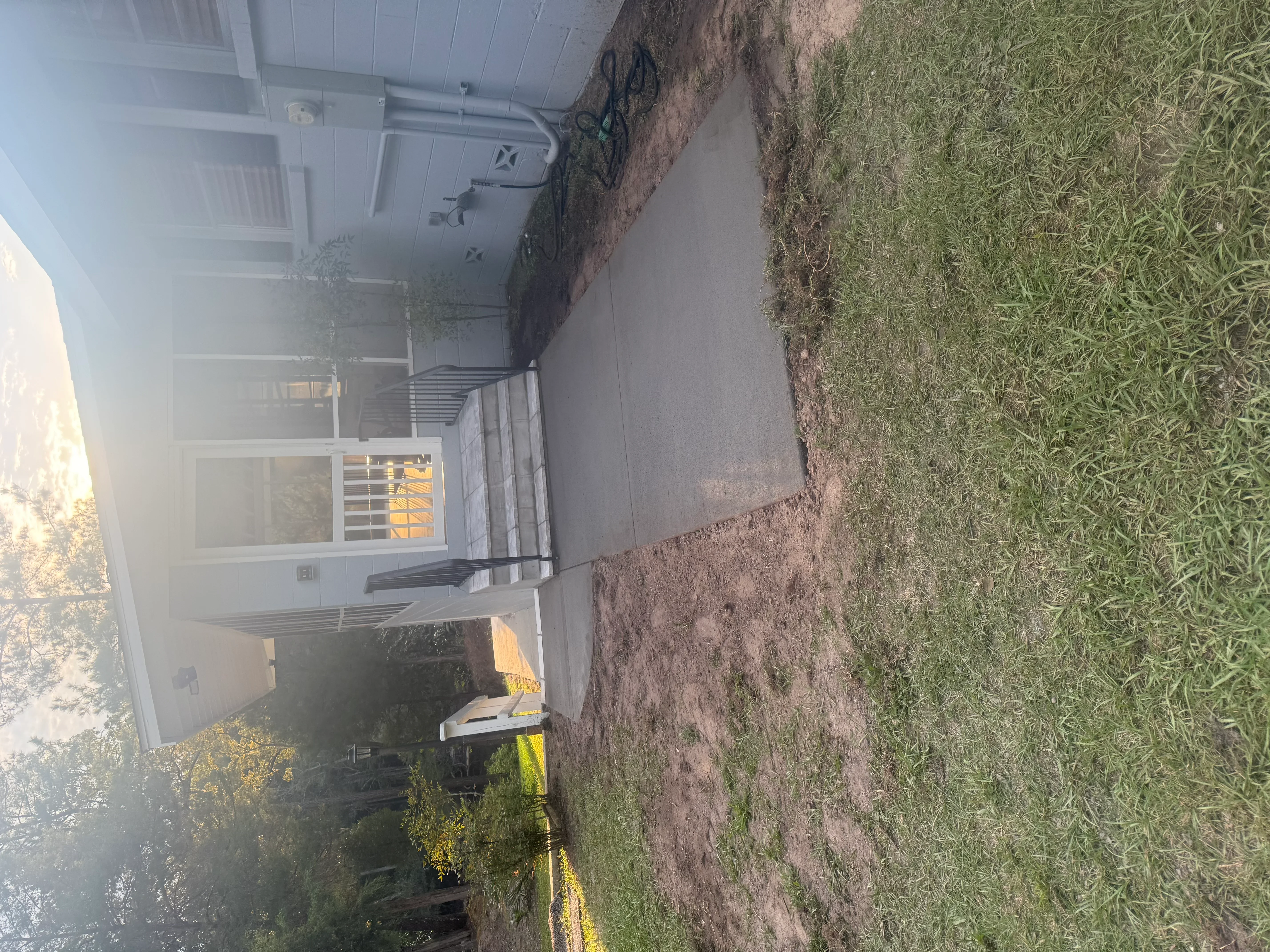 Finished concrete driveway and walkway at residential home entrance